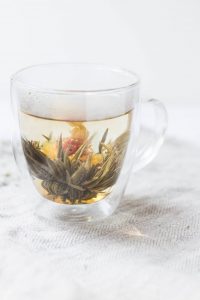 Flower tea or Blooming tea are a flower with tea leaves that are dried